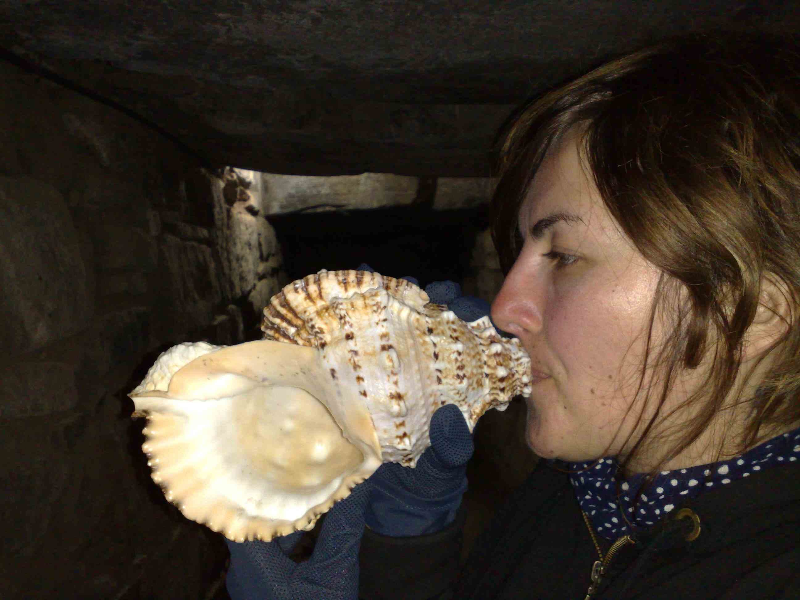 Cobi playing a coinch shell in Peru.